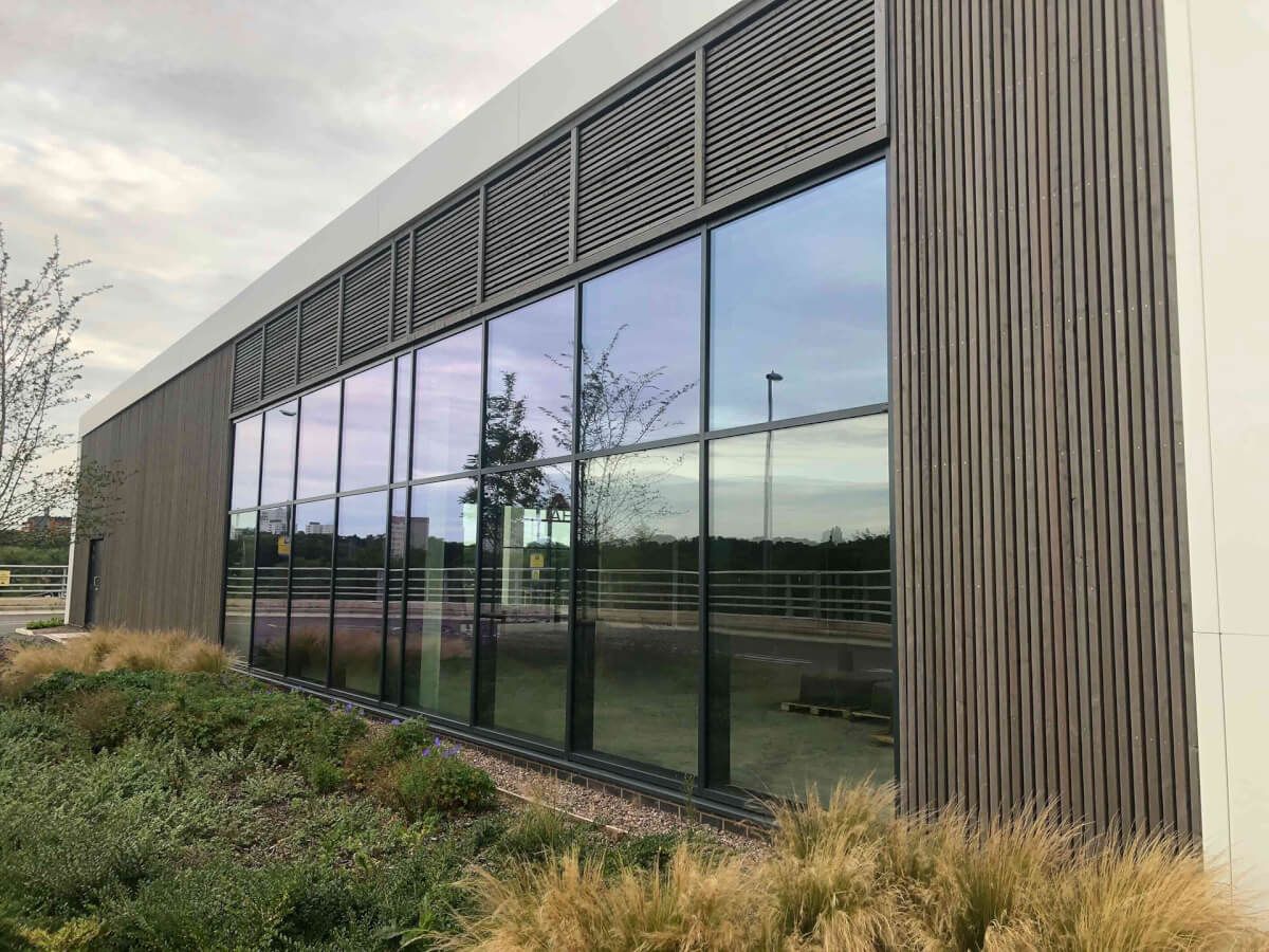 Full-height aluminium curtain walling with solar-control glazing on a modern commercial building