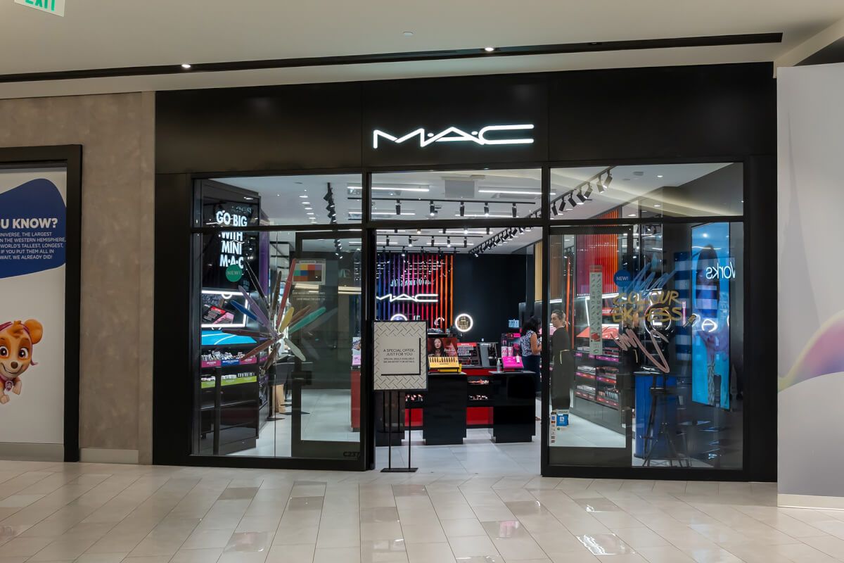 Black-framed glass shopfront for a M·A·C Cosmetics store in a shopping centre