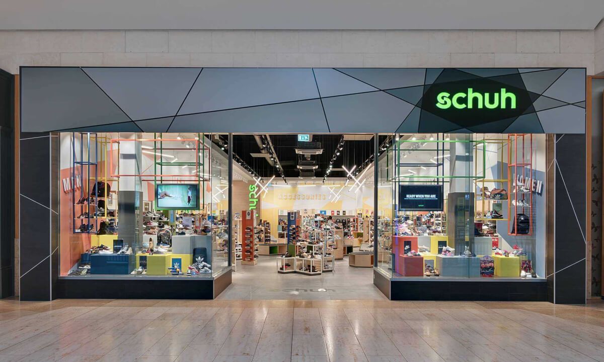 Glazed shopfront with illuminated fascia for a schuh store in a shopping centre