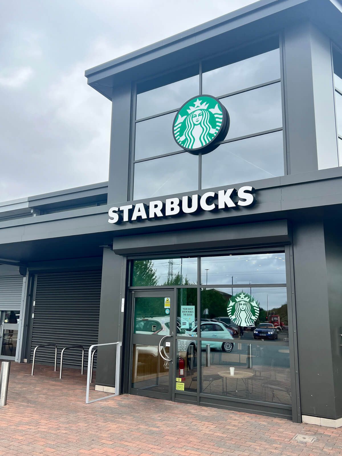 Aluminium shopfront glazing and entrance doors at a Starbucks drive-thru unit